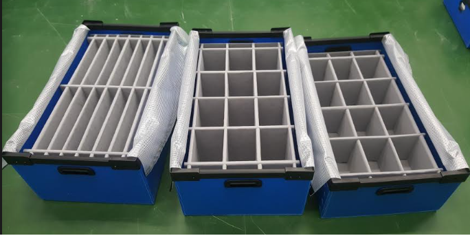 Blue corrugated plastic tray with custom blue foam interior for component protection.