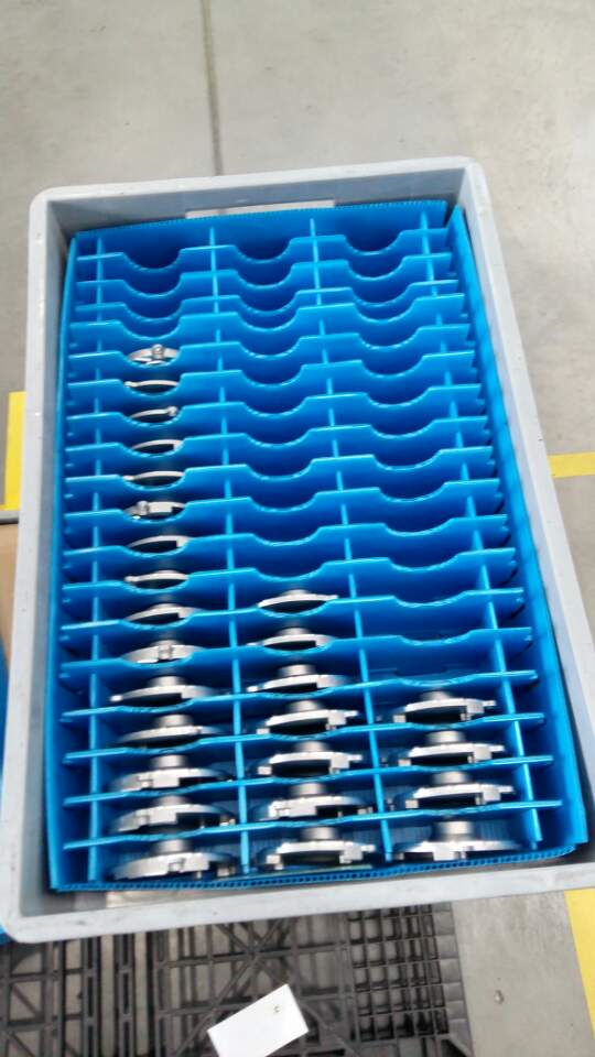 Two blue corrugated plastic containers with reinforced corners and internal dividers.